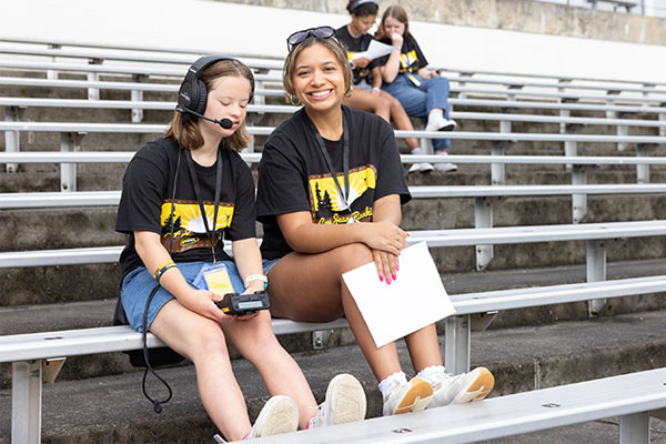Camp Jean Rankin campers sitting on football bleachers